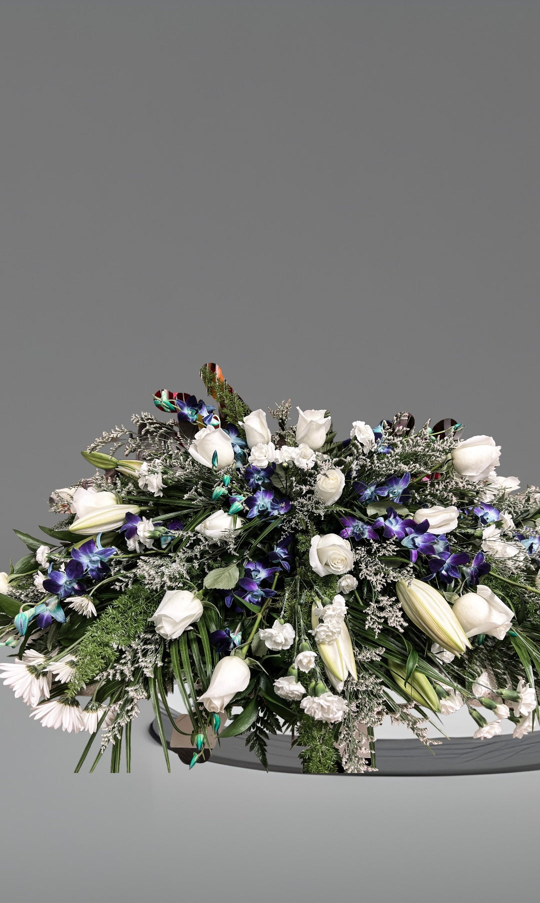 Blue Orchid Casket Spray